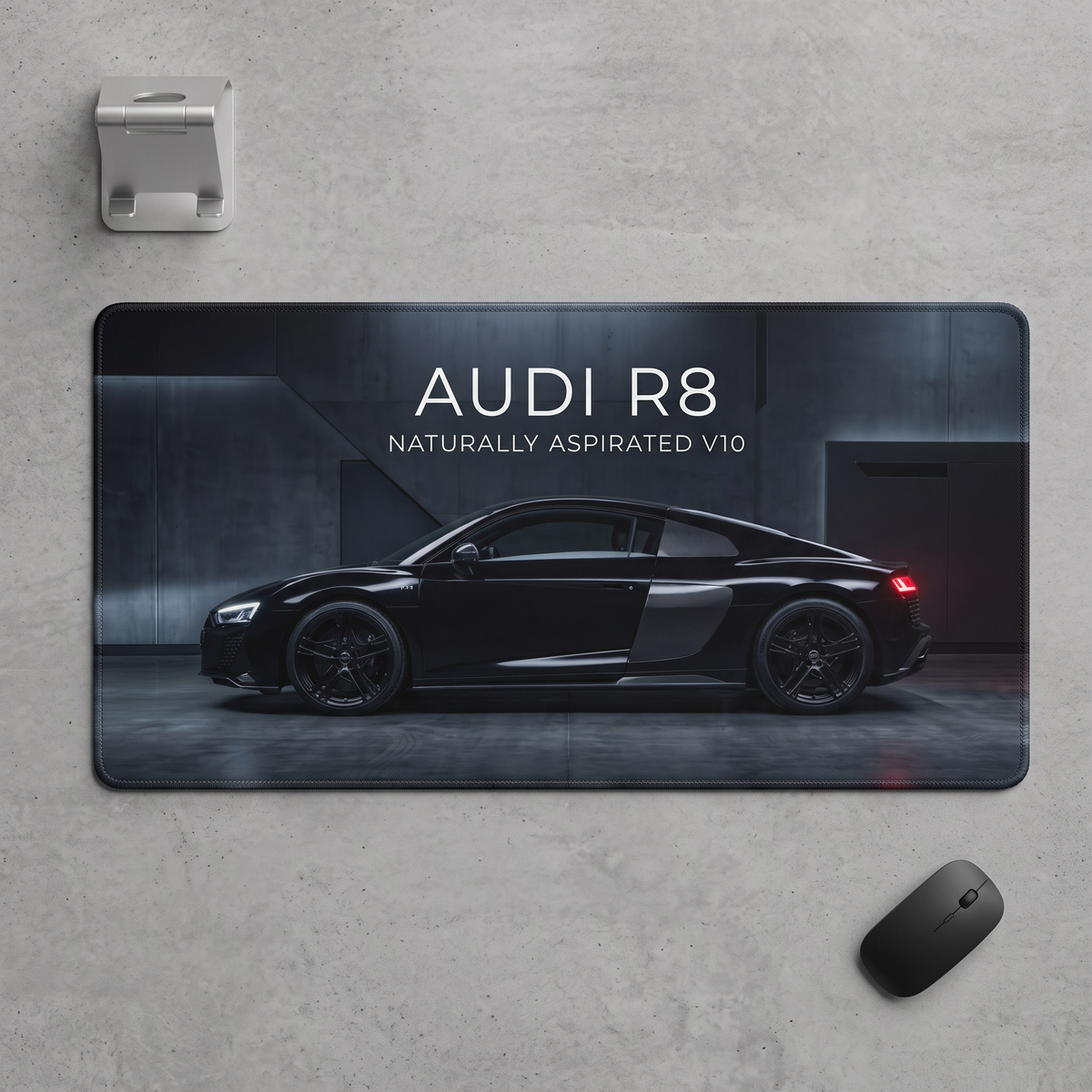 Audi R8 V10 gaming desk mat on dark wooden desk setup with RGB keyboard
